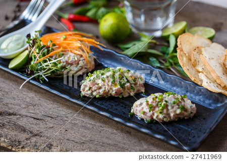 Fish tartare with herbs and carrot Fish tartare with herbs and carrot 27411969