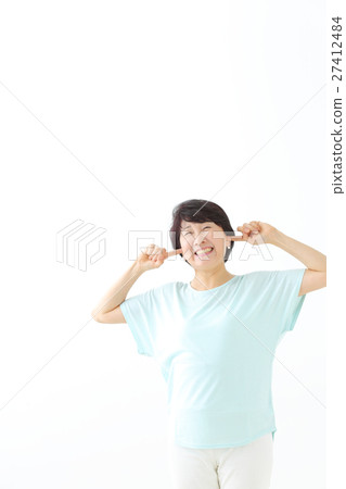 A woman clogging the ear 27412484