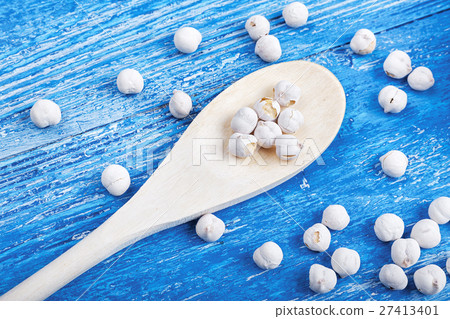 spilled chickpeas on a wooden background spilled chickpeas on a wooden background 27413401