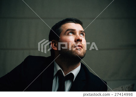 businessman looks up the light businessman looks up the light 27414998