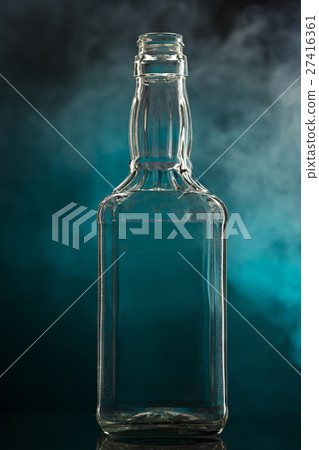 Empty colorless glass bottle 27416361