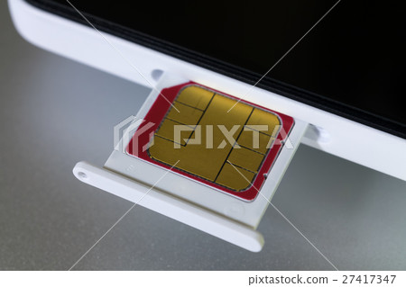 MicroSIM card inserted in smartphone 27417347