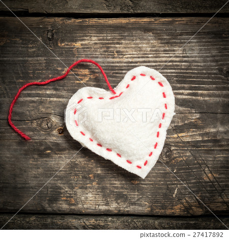 Colorful knitted hearts on the dark old boards Colorful knitted hearts on the dark old boards 27417892