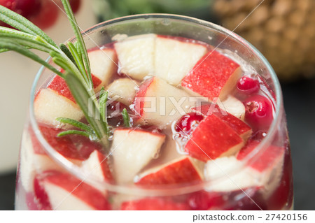 Sangria with cranberries, apples and rosemary Sangria with cranberries, apples and rosemary 27420156