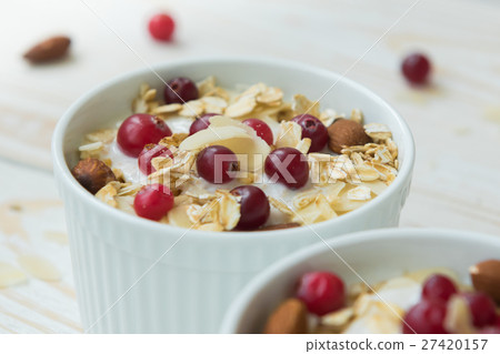 Yogurt with cranberries, oatmeal, almond flakes Yogurt with cranberries, oatmeal, almond flakes 27420157