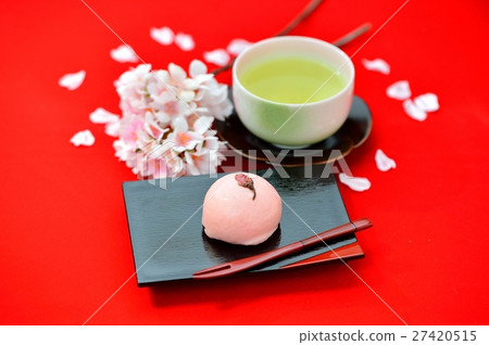 Spring Japanese confection, Cherry Manju / Cherry Bun and image of green tea. Attention) Cherry blossoms in the background are artificial flowers. Spring Japanese confection, Cherry Manju / Cherry Bun and image of green tea. Attention) Cherry blossoms in the background are artificial flowers. 27420515