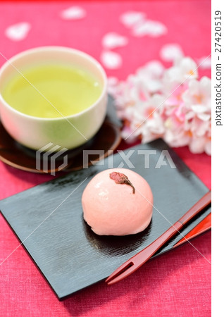 Spring Japanese confection, Cherry Manju / Cherry Bun and image of green tea. Attention) Cherry blossoms in the background are artificial flowers. 27420519
