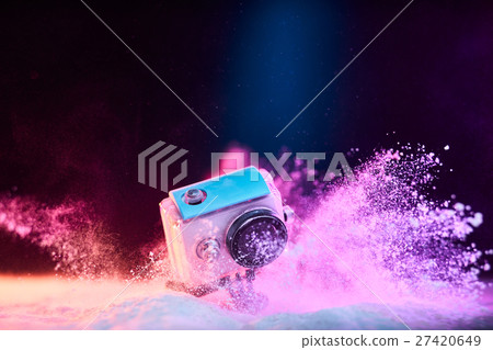 action camera in waterproof case dropped in powder 27420649