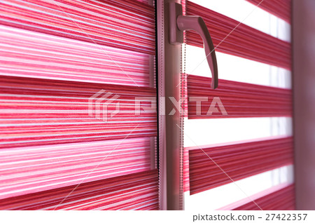 Fabric roller blinds on the window. Fabric roller blinds on the window. 27422357