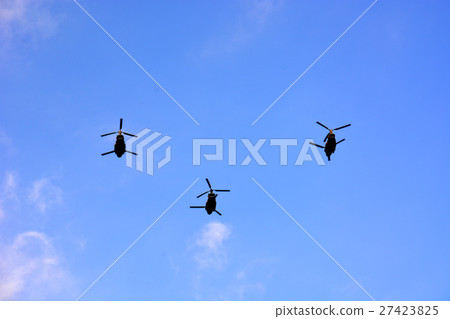 A helicopter flying in the blue sky 27423825