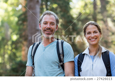 Portrait of hiker couple hiking in forest Portrait of hiker couple hiking in forest 27426013