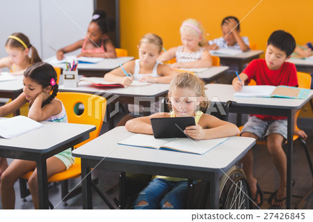 School kids studying in classroom 27426845