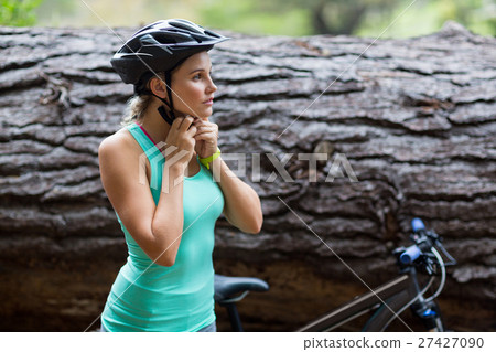 Female athletic wearing bicycle helmet Female athletic wearing bicycle helmet 27427090