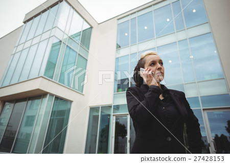 Businesswoman talking on mobile phone 27428153