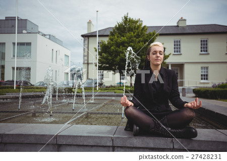 Businesswoman practicing yoga 27428231