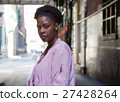 Portrait of young black woman in dark city street 27428264