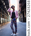 Portrait of young black woman in dark city street 27428268