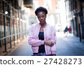 Portrait of young black woman on city street 27428273