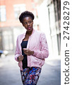 Portrait of young black woman on city street 27428279