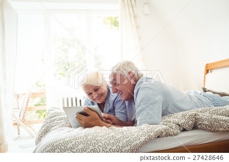 Senior couple using digital tablet 27428646