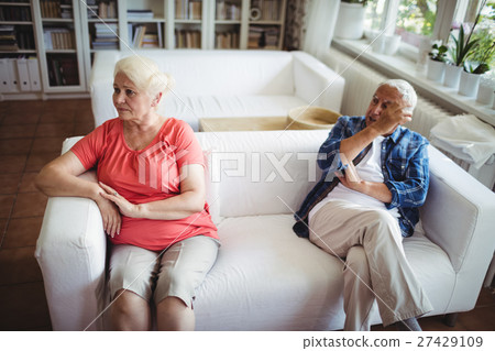 Upset senior couple ignoring each other Upset senior couple ignoring each other 27429109