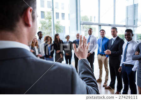 Businessman interacting with colleagues 27429111