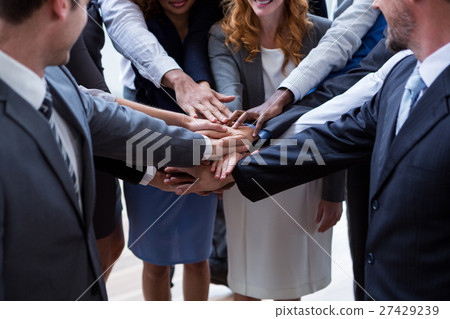 Businesspeople with hand stacked 27429239