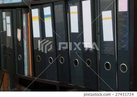 File Archive on wooden floor 27431724