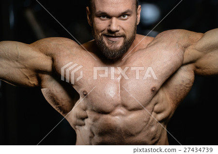 Brutal strong bodybuilder athletic men pumping up 27434739