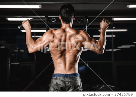 man with weight training in gym equipment sport man with weight training in gym equipment sport 27435799