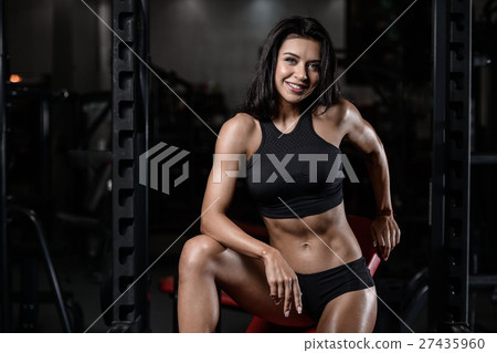 sexy brunette fitness wet woman after workout gym 27435960