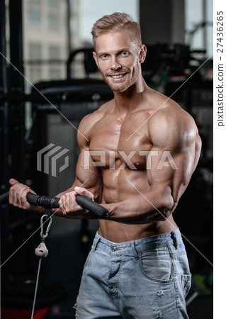 Strong and handsome athletic young man muscles abs 27436265