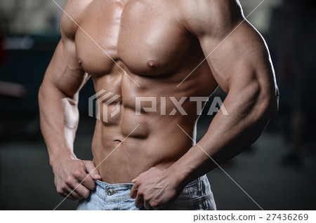 Strong and handsome athletic young man muscles abs 27436269