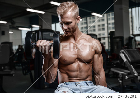 Strong and handsome athletic young man muscles abs 27436291