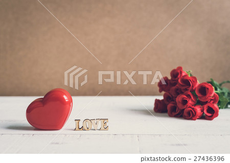 Red heart shape with word "love" and red rose 27436396