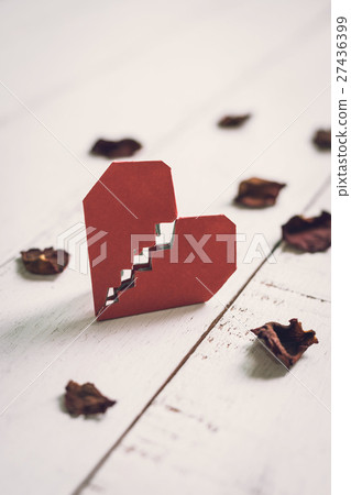 Red broken heart with dried rose petal 27436399