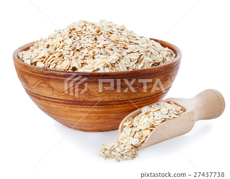 Oat flakes in bowl and wooden spoon on white Oat flakes in bowl and wooden spoon on white 27437738
