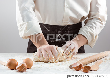 Hands kneading a dough 27437833