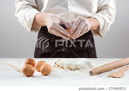 Hands kneading a dough Hands kneading a dough 27440953