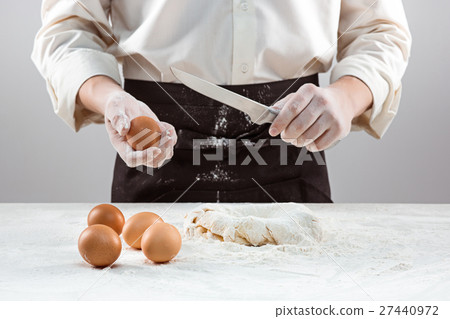 Hands kneading a dough 27440972