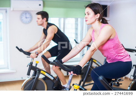 Group training people biking in the gym Group training people biking in the gym 27441699