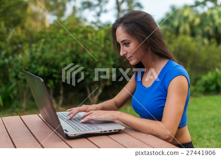 Young female entrepreneur working on netbook 27441906