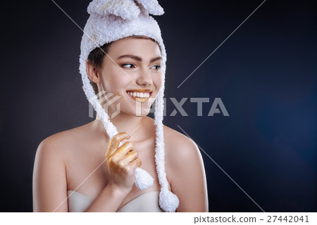 Posiive woman posing in funny hat 27442041