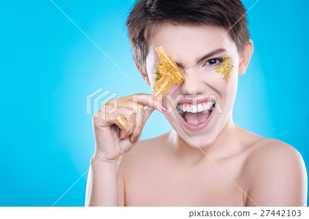 Cheerful woman having fun on blue background 27442103