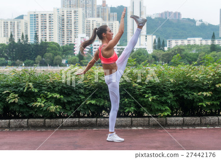 Fitness woman stretching her legs doing yoga 27442176