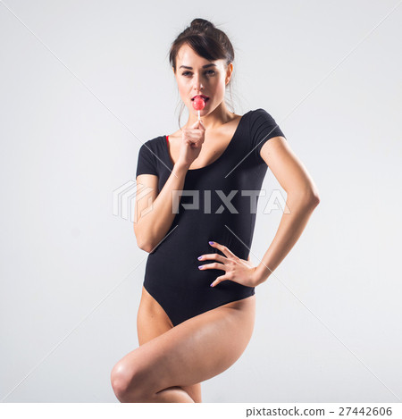 Young brunette model with lollipop studio shot on Young brunette model with lollipop studio shot on 27442606
