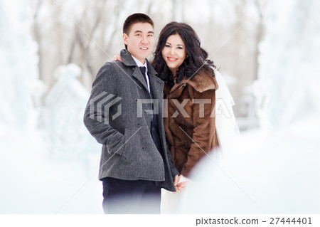 Winter wedding, the bride with veil, groom in 27444401