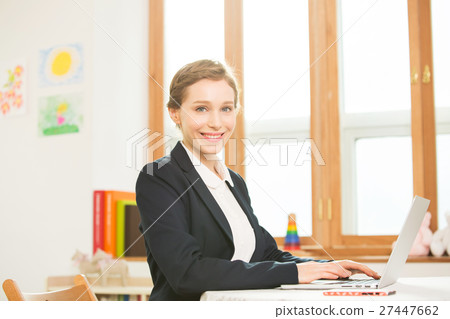 Foreign Female Teacher At Her Desk 27447662