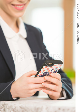Foreign Female Teacher Looking At Her Phone Foreign Female Teacher Looking At Her Phone 27447663