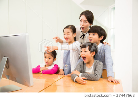 A Female Teacher And Her Young Students 27447668
